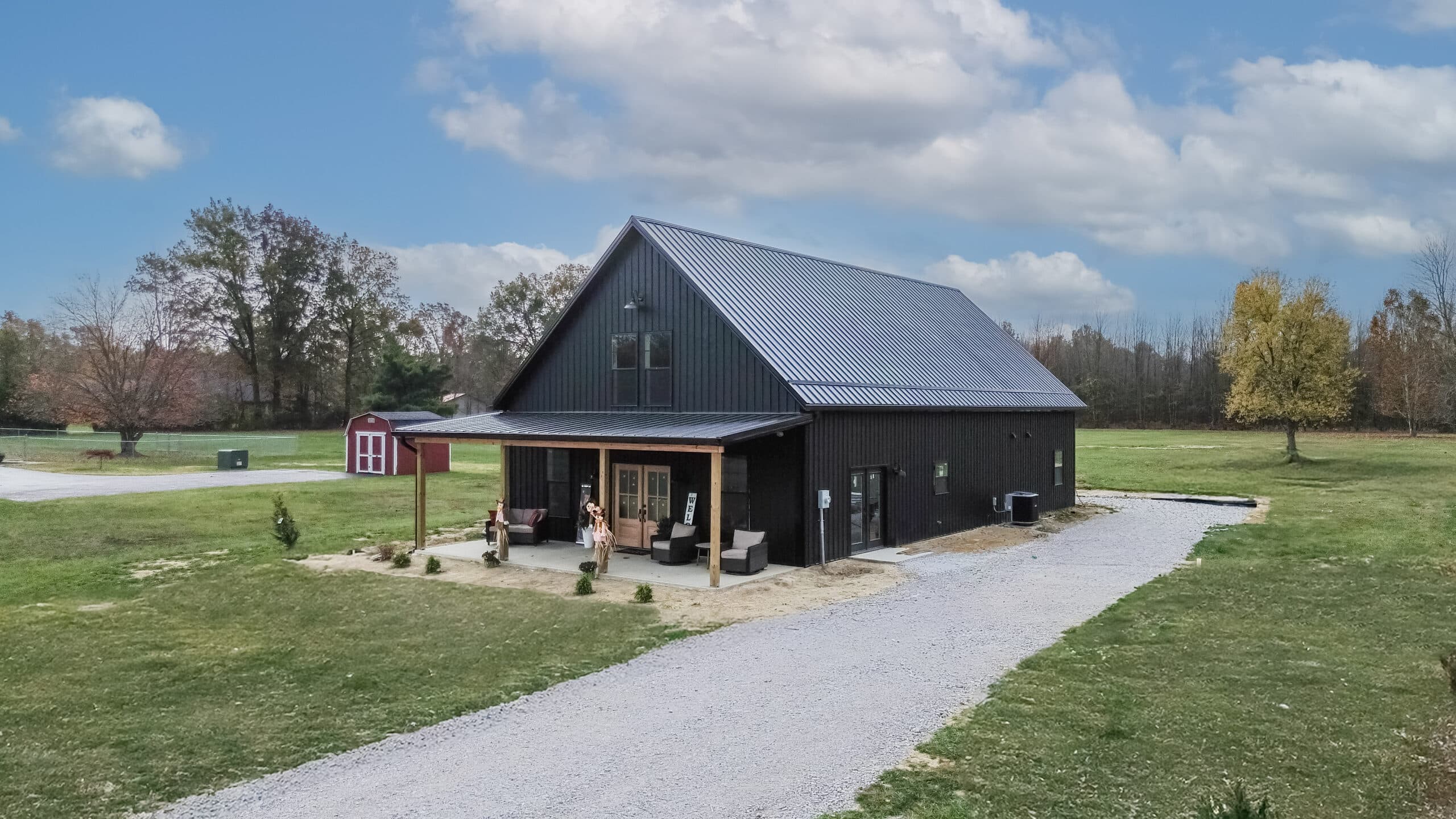 black 20x48 barndominium kit with porch
