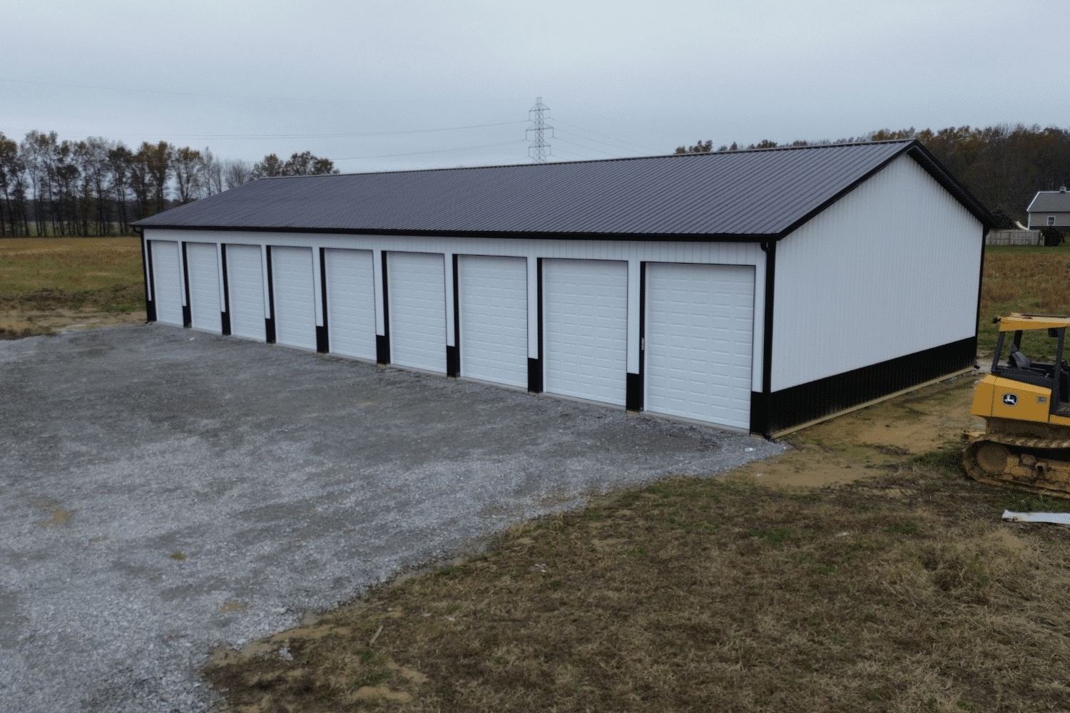 white 30x48 garage pole barn kit with nine garages and black roof