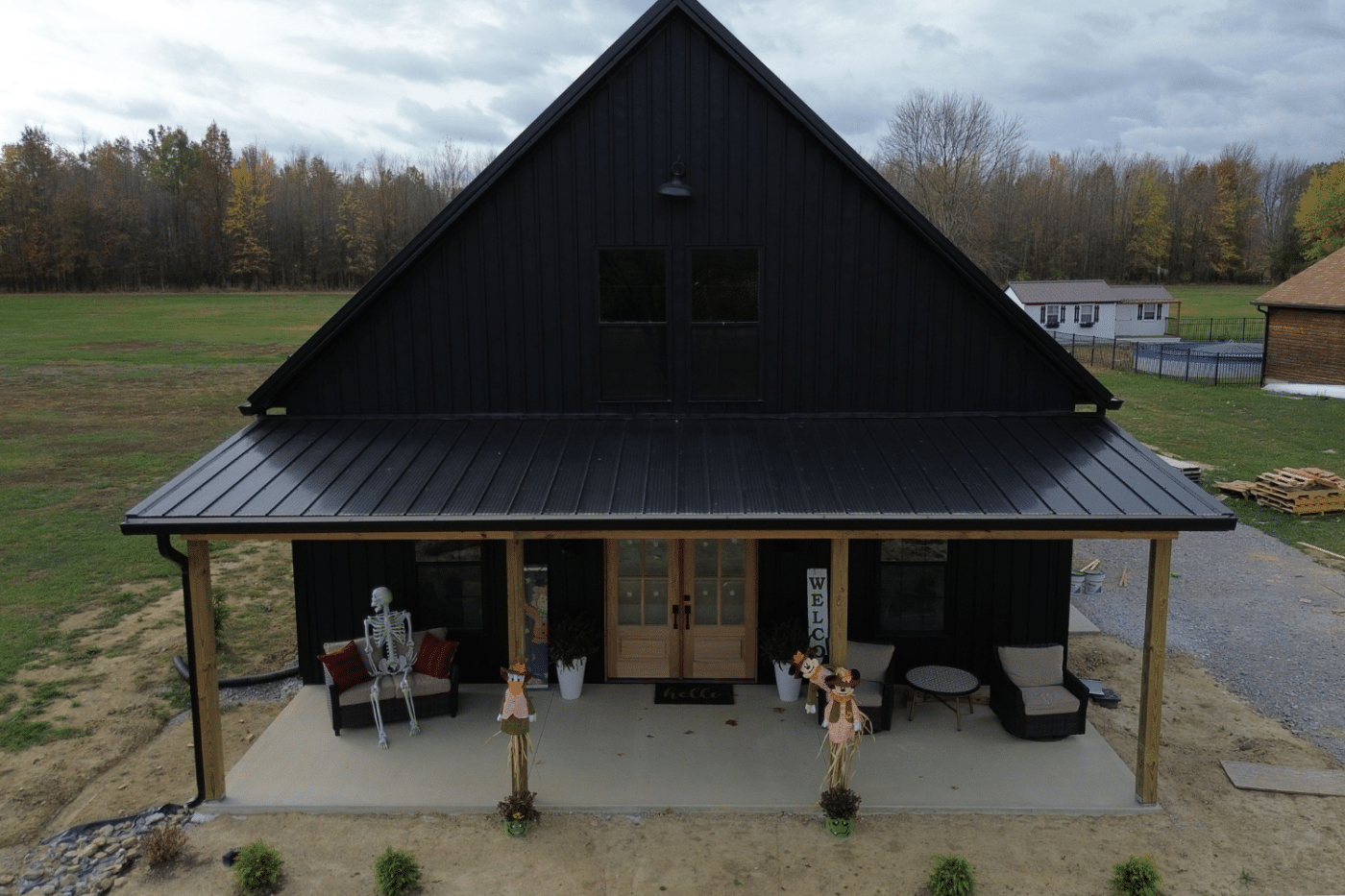 30x60 black barndominium in williamsburg ohio with porch