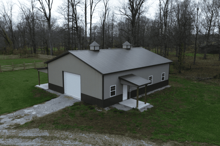 beige garage pole barn kit with one white garage and cupolas in Alexandria KY