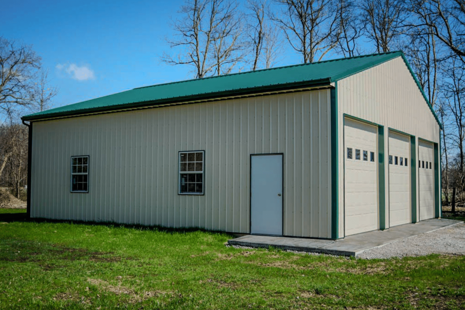 60x80 beiege and green three garage pole barn kit with two windows and entry door