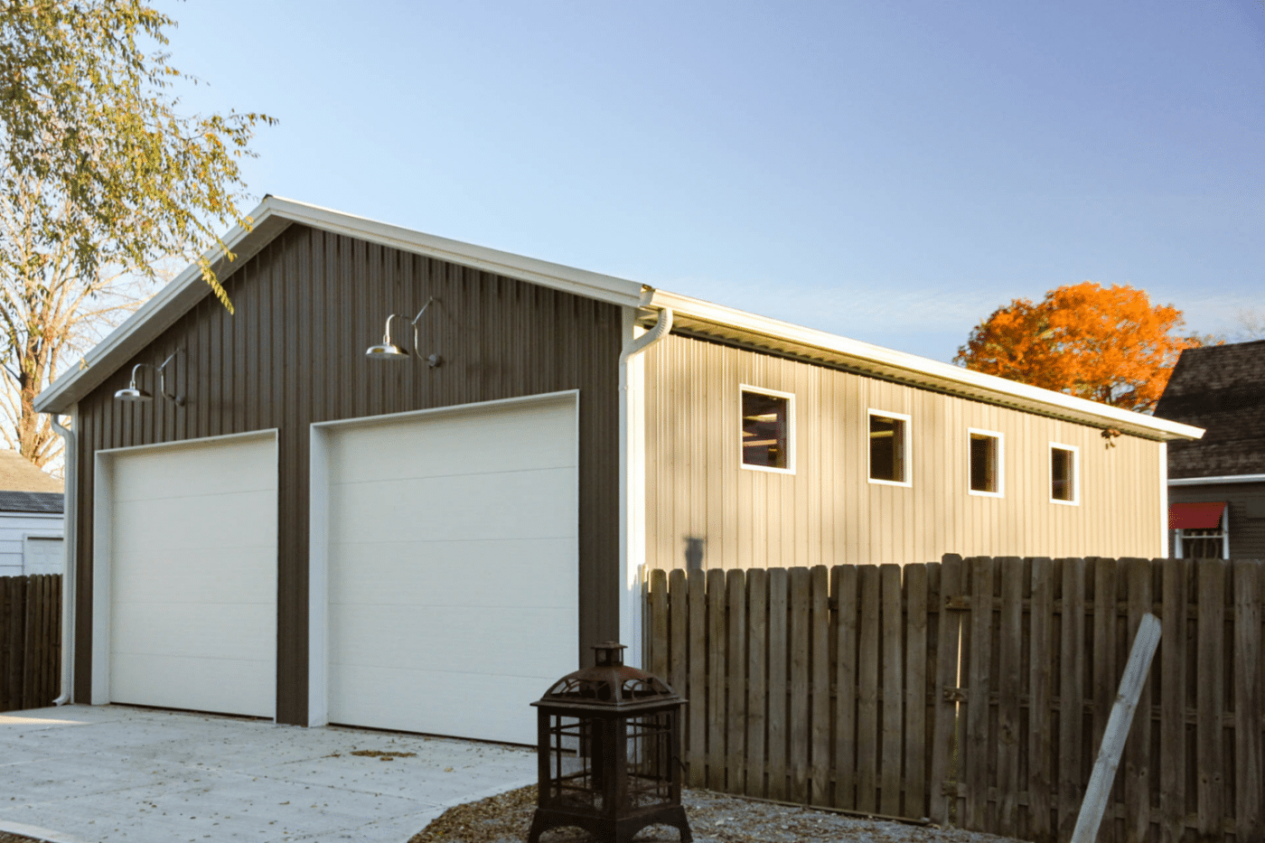 60x80 brown two car garage pole barn kit with lights and windows