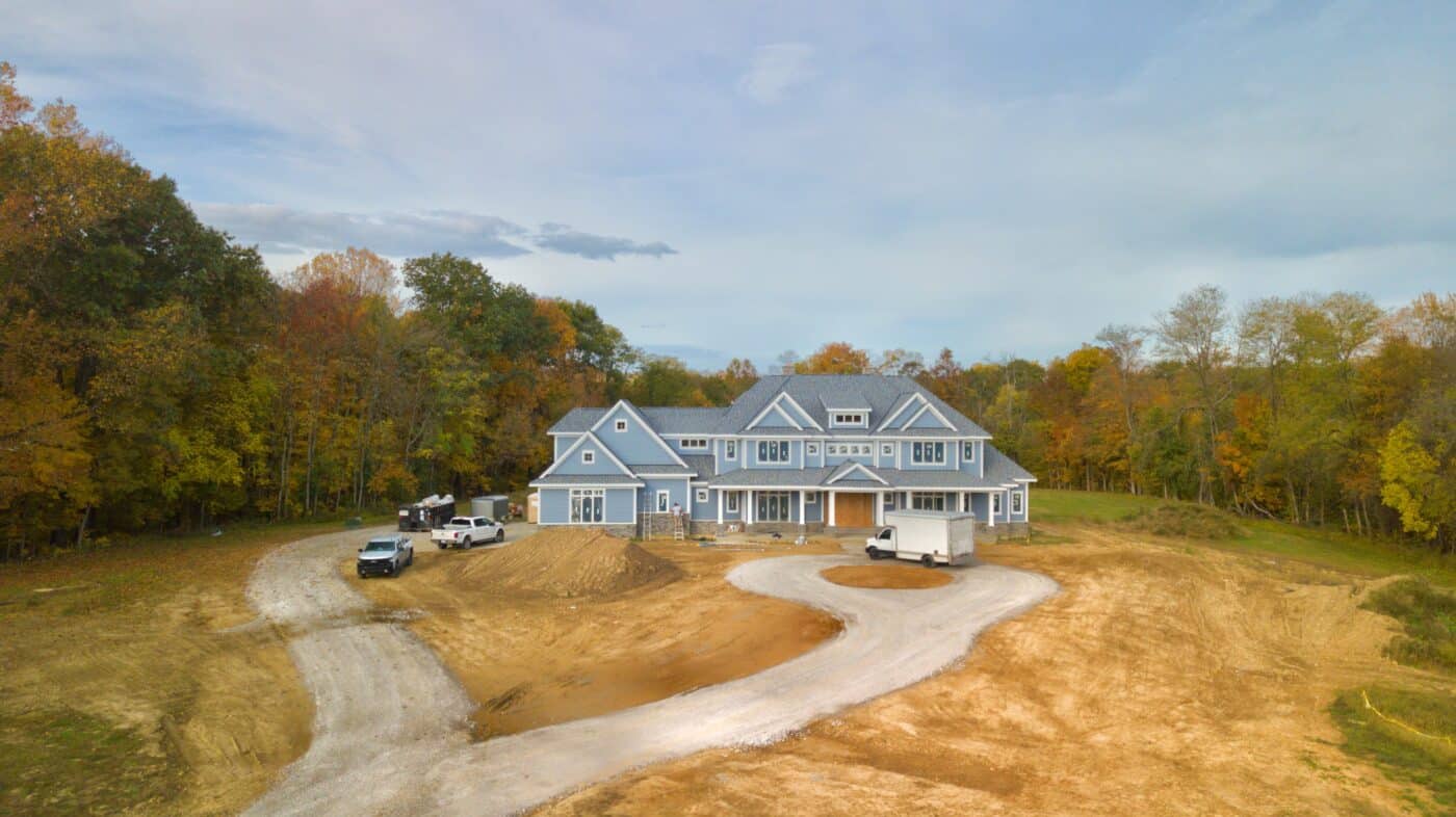 blue and grey big residential pole barn kit in McArthur OH