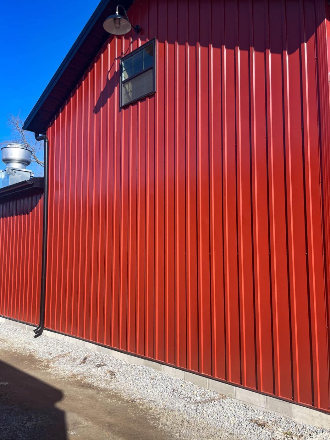 the side of a red metal dairy barn in leesburg OH