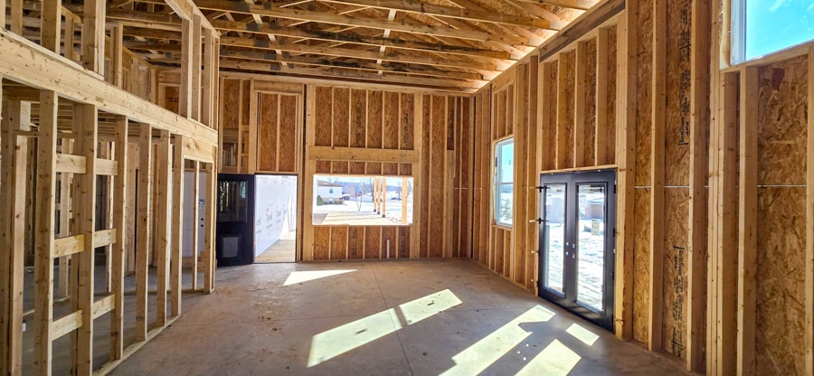 interior roof trusses in home with double doors