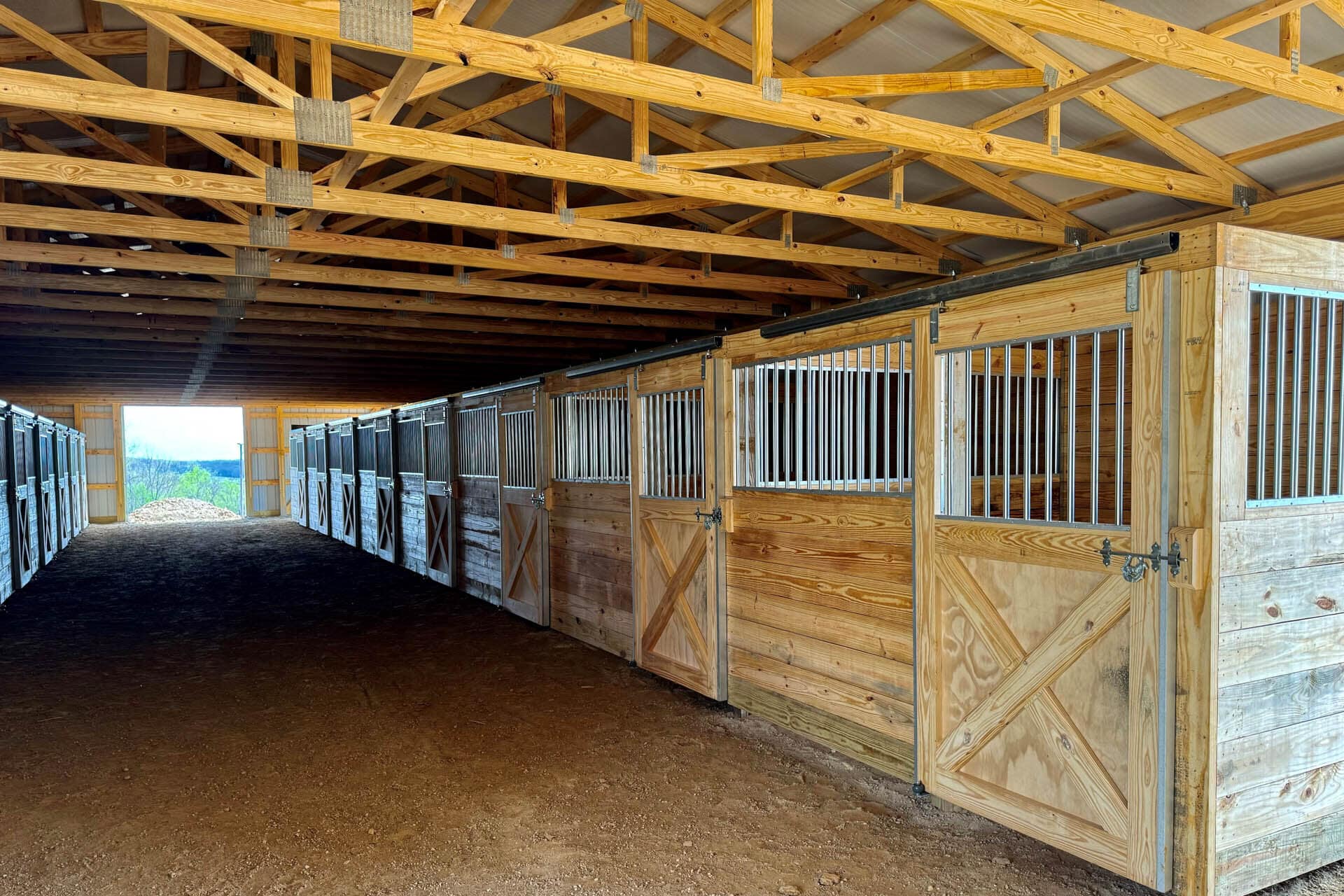 multiple stalls inside of a 40x60 agricultural pole barn