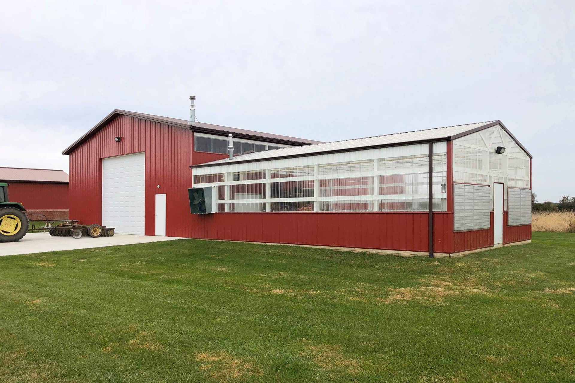 red a-loc metal panels on a pole barn with clear windows in winchester oh