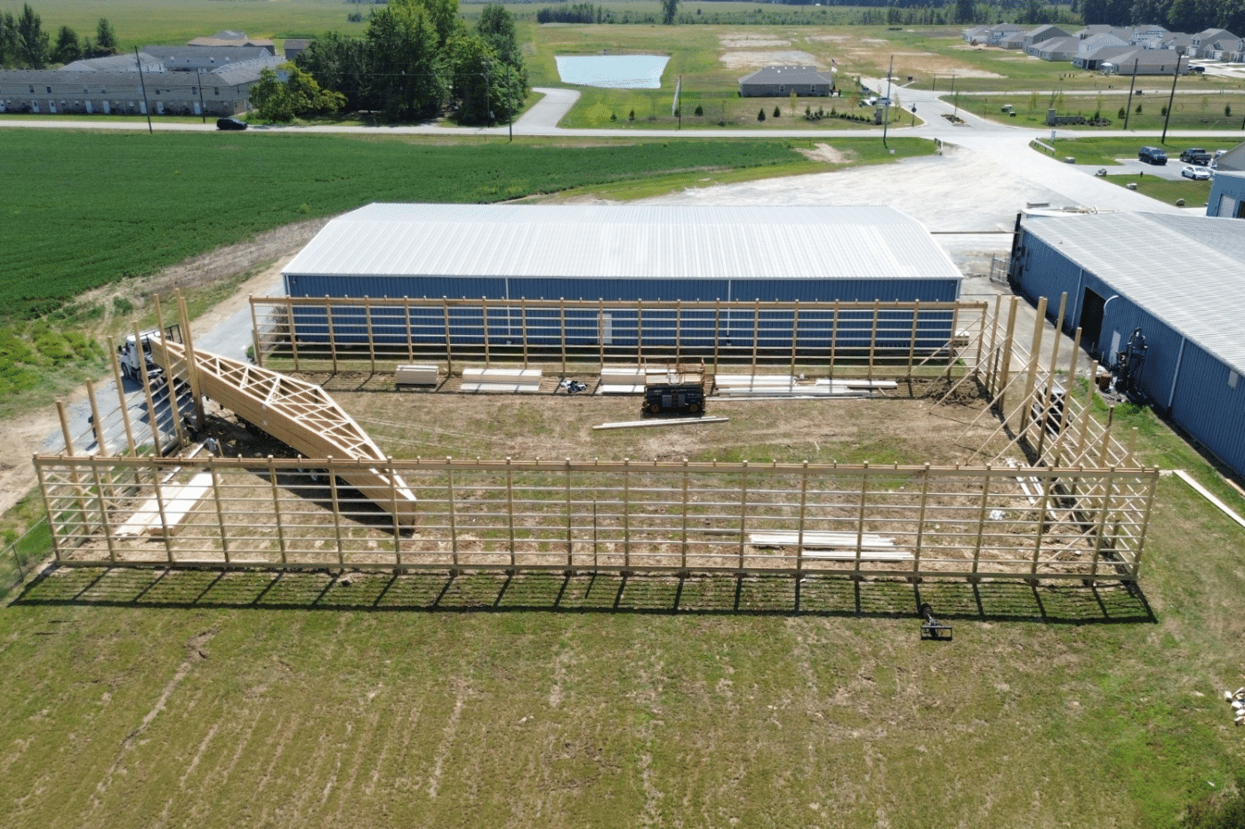 truck bringing roof trusses for 24x40 garage pole barn kit in felicity ohio