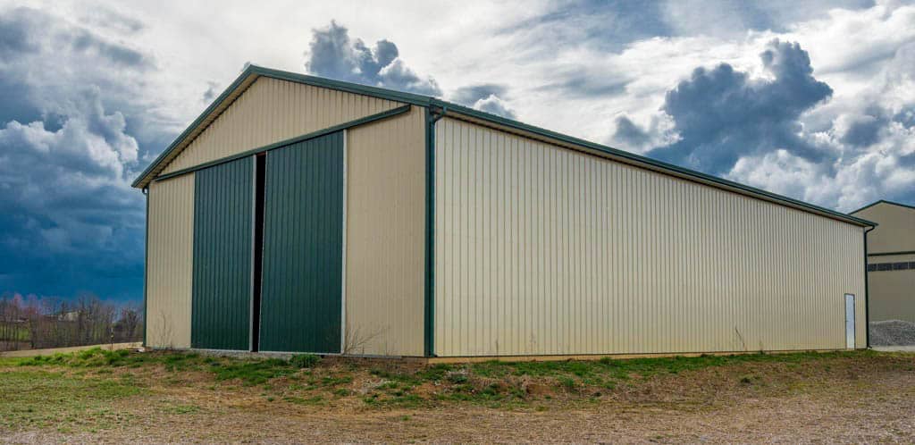 tan and green door on a 40x60 equestrian pole barn