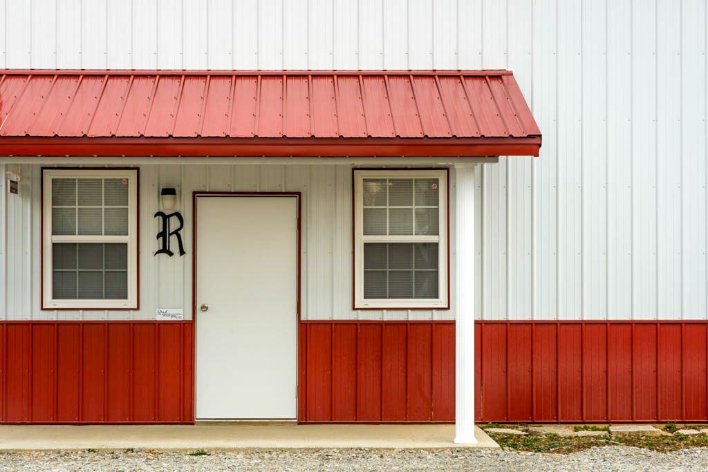 white and red metal panels on the side of a 36x60 agricultural pole barn