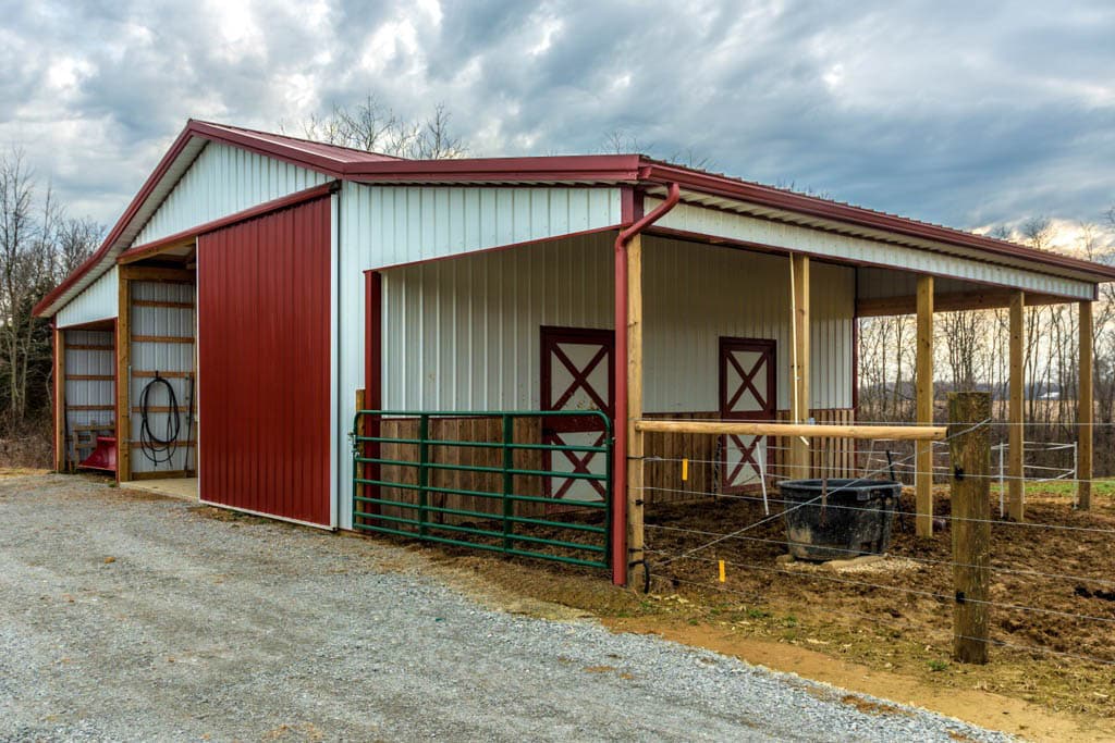 white and red trimmed 40x60 pole barn